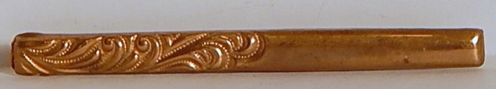 EDWARDIAN BAR PIN EMBOSSED BRASS W/ ROLLED GOLD? TOP