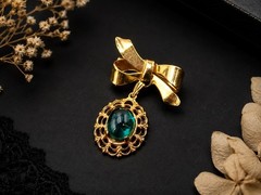 Vintage Gold Tone Bow Brooch with Emerald Green Glass Cabochon Dangle