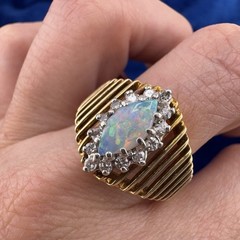 Vintage circa 1970s 14k Yellow Gold Marquise Opal Ring with Diamond Halo
