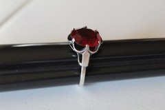 MARKED STERLING SARAH COV SIZE 8.5 RING WITH PRONG SET RED STONE