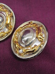 Pair vintage Jackie Collins gold and silver tone oval clip on earrings