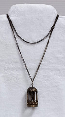 Brass Tone Bird in Cage Pendant Necklace 32″ Chain Vintage Style