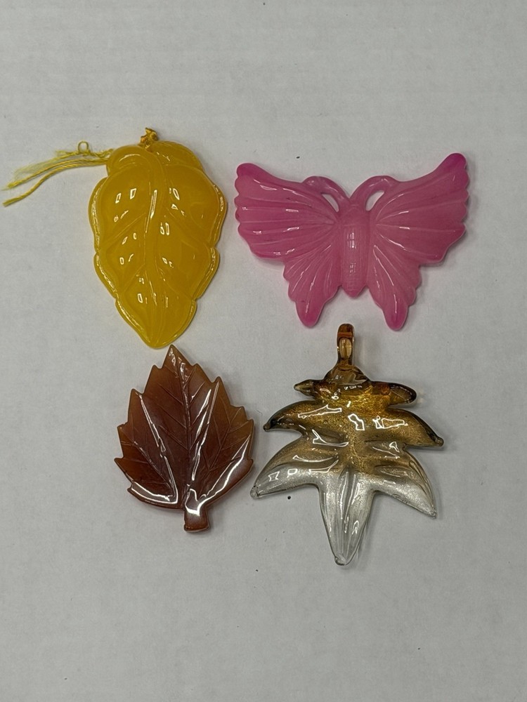 Lot Of 4 Vintage-style translucent plastic leaf and butterfly pendants/jewelry