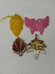 Lot Of 4 Vintage-style translucent plastic leaf and butterfly pendants/jewelry
