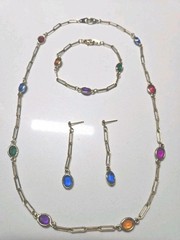 Mid Century 60′ 80′ gold-tone paperclip-style chainoval bezel-set colored Glass