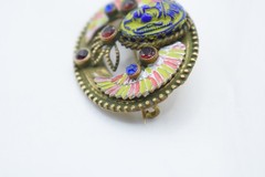 Antique Egyptian Revival winged scarab brooch featuring vibrant enamel work