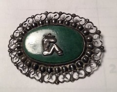 A vintage sterling silver made in Mexico brooch. Mexico jade with man siesta .