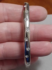 Crystal polka dot bangle bracelet Silvertone flush set stones eternity band
