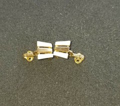 VINTAGE 1955-1969 TRIFARI GOLD TONED METAL AND WHITE ENAMEL CLIP ON EARRINGS