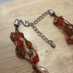 VNTG necklace w/circle discs in copper and silvertones Orange, brown&Red Beads.