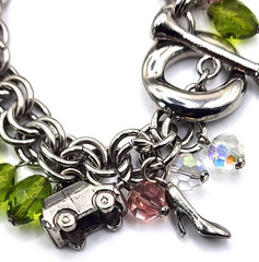 Vintage silvertone & glass charm bracelet with rare car, gold card, cell phone