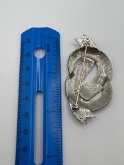 VINTAGE SILVER TONE BOW IN DOLLAR SIGN LIKE SHAPE BROOCH
