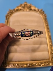 Mexico Alpaca silver hinged bangle bracelet featuring a colorful enameled flower