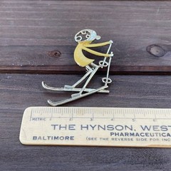 Vintage Ski Pin Falling Skier Gold Tone Yellow Enamel Cartoon Style R.N. Koch