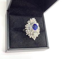 18K White Gold 5.90ctw Oval Blue Sapphire & Tapered Baguette Diamond Ring