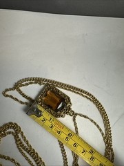 32 in.³ triple strand Goldette amber colored faceted glass necklace