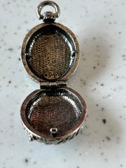 Goldette silver toned floral locket pendant