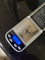 Antique ring with unknown dark teal marquis shaped stone And Clear Round Stones