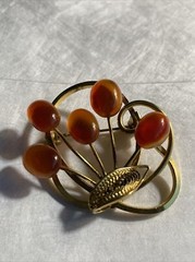 Vintage gold tone brooch with amber colored stones