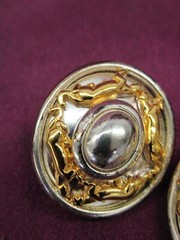 Pair vintage Jackie Collins gold and silver tone oval clip on earrings