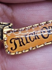 Vintage John Wind Maximal Art Halloween Trick or Treat Banner Brooch Pin