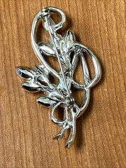 vintage rhinestone floral spray brooch, similar to designs from the 1940s-1950s