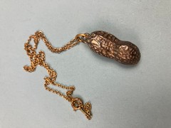 Vintage plated pewter peanut pendant in 16″ chain