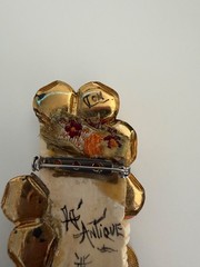 VINTAGE ASIAN BROOCH WITH CARVED FACE AND JEWLEL SIGNED