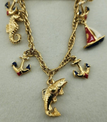Unbranded Gold Tone Brooch Bar With Chain and 7 Nautical Themed Charms
