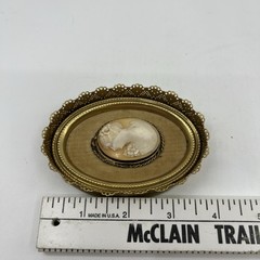 Vintage Oval Shell Cameo Portrait in Brass Ornate Filigree Frame Beige White