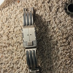 lot of pin, belt buckel and watches