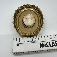 Vintage Oval Shell Cameo Portrait in Brass Ornate Filigree Frame Beige White