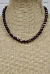 Genuine knotted pearl necklace with 14-karat yellow gold clasp