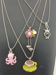 New Old Stock lot of 4 COOKIE LEE silver tone assorted figural pendant necklaces