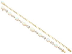 9.50Ct White Opal and 0.24Ct Diamond 15k Yellow Gold Necklace / Bracelet Set