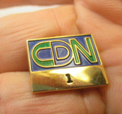 letters logo c d n lapel pin